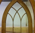 Arched glazed timber door